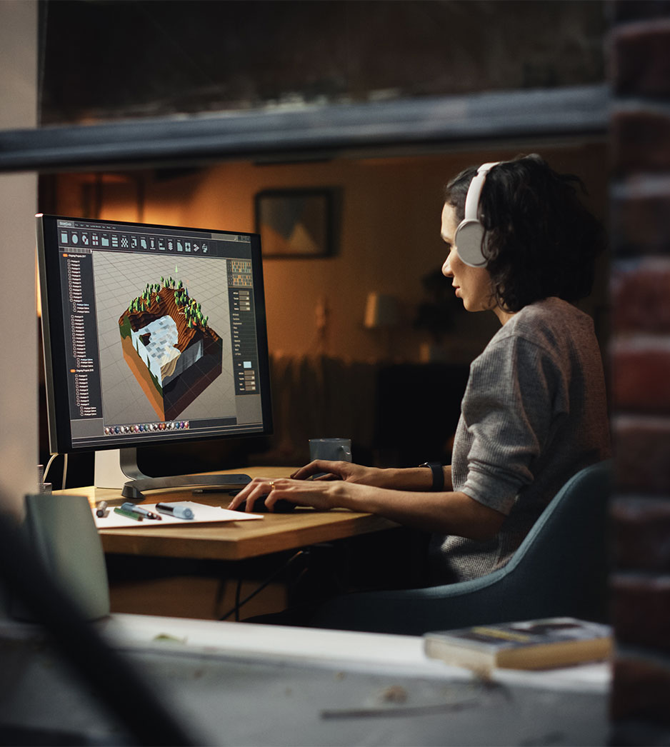 woman working at computer in 3d modeling software 2Dudes